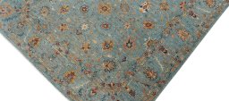 Backside of handmade New Farahan rug showing knot structure and weave density