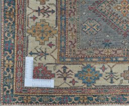 Corner detail of New Kazak rug showing border pattern and Wool pile