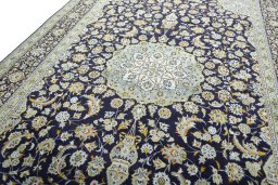 Backside of handmade 2000s Kashan rug showing knot structure and weave density