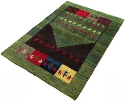 Corner detail of 2000s Persian Gabbeh rug showing border pattern and Wool pile