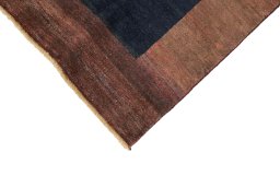 Backside of handmade New Persian Gabbeh rug showing knot structure and weave density