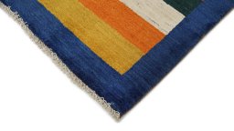 Backside of handmade New Persian Gabbeh rug showing knot structure and weave density
