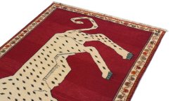 Surface texture of 1970s Persian Gabbeh rug with natural Wool and intricate pattern