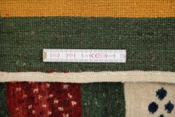 Corner detail of New Persian Gabbeh rug showing border pattern and Wool pile