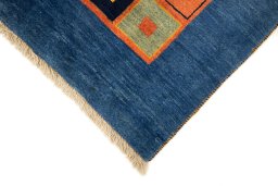 Backside of handmade 2000s Persian Gabbeh rug showing knot structure and weave density