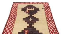 Surface texture of 1920s Persian Gabbeh rug with natural Wool and intricate pattern