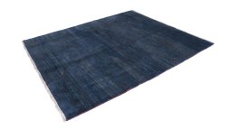 Corner detail of 1980s Persian Gabbeh rug showing border pattern and Wool pile