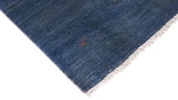 Backside of handmade 1980s Persian Gabbeh rug showing knot structure and weave density