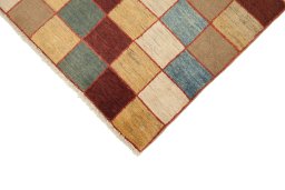 Backside of handmade New Persian Gabbeh rug showing knot structure and weave density