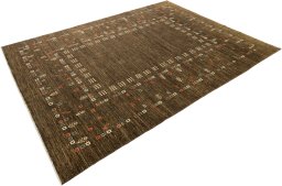 Corner detail of 1980s Persian Gabbeh rug showing border pattern and Wool pile