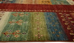 Corner detail of New Persian Gabbeh rug showing border pattern and Wool pile