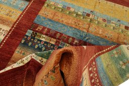 Backside of handmade New Persian Gabbeh rug showing knot structure and weave density