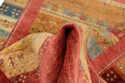 Backside of handmade New Persian Gabbeh rug showing knot structure and weave density