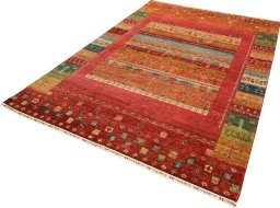 Corner detail of New Persian Gabbeh rug showing border pattern and Wool pile