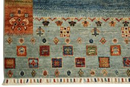 Corner detail of New Persian Gabbeh rug showing border pattern and Wool pile