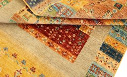 Corner detail of New Persian Gabbeh rug showing border pattern and Wool pile