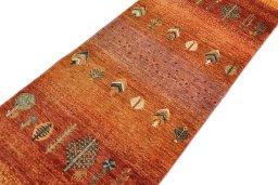 Backside of handmade New Persian Gabbeh rug showing knot structure and weave density