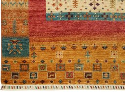 Corner detail of New Persian Gabbeh rug showing border pattern and Wool pile
