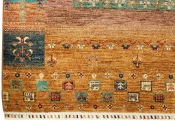Corner detail of New Persian Gabbeh rug showing border pattern and Wool pile