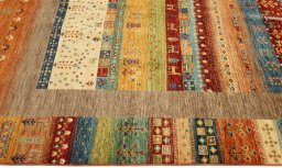 Full view of New Persian Gabbeh rug from Pakistan, 239 × 172 cm in Multi Color tones
