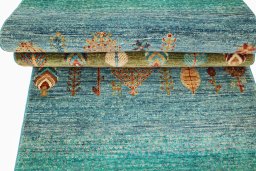 Corner detail of New Persian Gabbeh rug showing border pattern and Wool pile