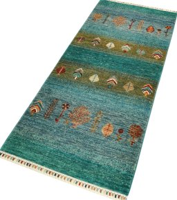 Corner detail of New Persian Gabbeh rug showing border pattern and Wool pile