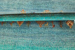 Corner detail of New Persian Gabbeh rug showing border pattern and Wool pile