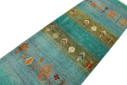 Backside of handmade New Persian Gabbeh rug showing knot structure and weave density