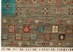 Corner detail of New Persian Gabbeh rug showing border pattern and Wool pile