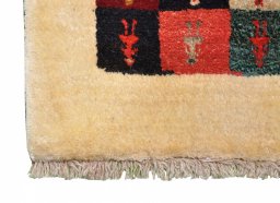 Backside of handmade 2000s Persian Gabbeh rug showing knot structure and weave density