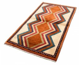 Corner detail of 2000s Persian Gabbeh rug showing border pattern and Wool pile