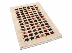 Corner detail of 2000s Persian Gabbeh rug showing border pattern and Wool pile