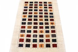 Surface texture of 2000s Persian Gabbeh rug with natural Wool and intricate pattern