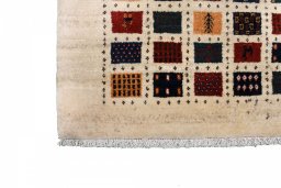 Full view of 2000s Persian Gabbeh rug from Iran / Persia, 123 × 83 cm in Beige tones