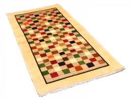 Corner detail of 2000s Persian Gabbeh rug showing border pattern and Wool pile