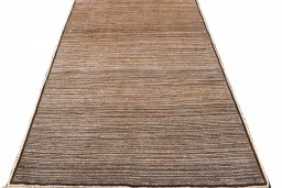 Surface texture of 2000s Persian Gabbeh rug with natural Wool and intricate pattern