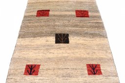Surface texture of 2000s Persian Gabbeh rug with natural Wool and intricate pattern