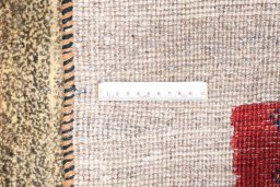 Full view of 2000s Persian Gabbeh rug from Iran / Persia, 147 × 111 cm in Beige tones