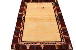 Surface texture of 2000s Persian Gabbeh rug with natural Wool and intricate pattern