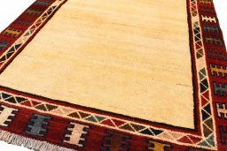 Backside of handmade 2000s Persian Gabbeh rug showing knot structure and weave density