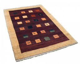 Corner detail of 2000s Persian Gabbeh rug showing border pattern and Wool pile