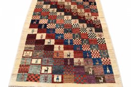 Surface texture of 2000s Persian Gabbeh rug with natural Wool and intricate pattern