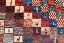 Backside of handmade 2000s Persian Gabbeh rug showing knot structure and weave density