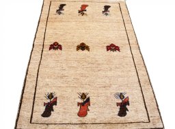 Surface texture of 2000s Persian Gabbeh rug with natural Wool and intricate pattern