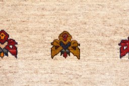Backside of handmade 2000s Persian Gabbeh rug showing knot structure and weave density