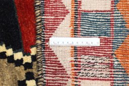 Close-up detail of 2000s Persian Gabbeh rug from Iran / Persia showing Wool weave