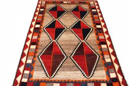 Surface texture of 2000s Persian Gabbeh rug with natural Wool and intricate pattern