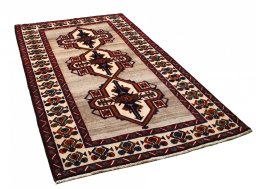 Corner detail of 2000s Persian Gabbeh rug showing border pattern and Wool pile