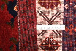 Corner detail of 2000s Persian Gabbeh rug showing border pattern and Wool pile