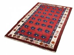 Corner detail of 2000s Persian Gabbeh rug showing border pattern and Wool pile
